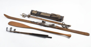 Vintage golf bag, 3 golf putters, a boat oar, pair of ski poles and an old wooden ski, 19th and early 20th century, the ski 195cm high