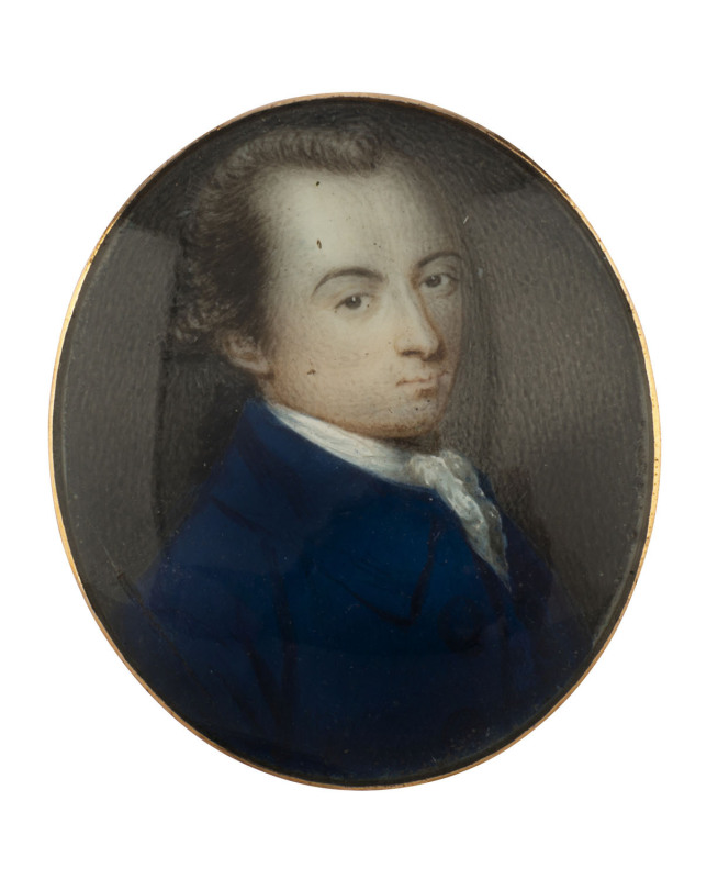 An 18th century miniature portrait of a gent in a blue coat, painted on ivory and housed in a gold mount, 3.5 x 3cm. PROVENANCE: Christie's lot 197, 4th July 1994.