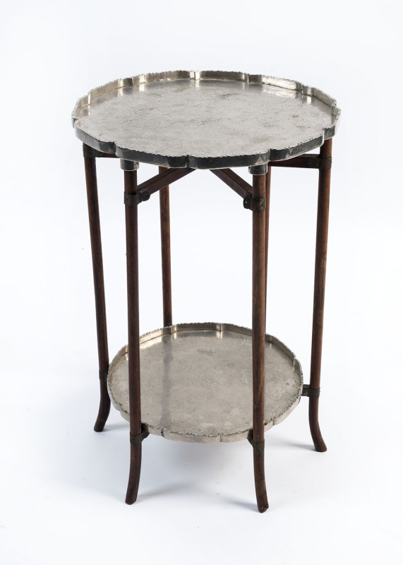 A Chinese two tier occasional table with silver plated tops and folding base, circa 1920, 54cm high, 38cm across