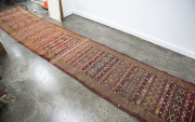 A tribal kilim flat weave rug, circa 1930, 500cm long, 86cm wide