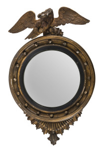 A convex gilt framed mirror with eagle crest, 19th century, 98cm high