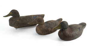 Three assorted antique and vintage decoy ducks, carved and painted wood, the largest 41cm long