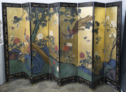 A Chinese 8 fold lacquered screen, circa 1900, 184cm high, 320cm wide