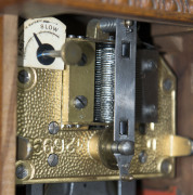 A German musical clock with 4½" disc player accompanied by approximately 45 discs, late 19th century, 32cm high - 5