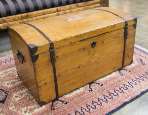 A domed lift top trunk, pine with iron fixtures, 19th century, 47cm high, 91cm wide, 45cm deep