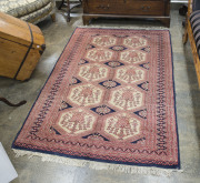 A Persian red and blue pattern rug, 20th century, 190 x 125cm