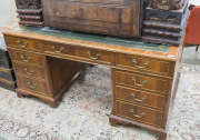 A reproduction twin pedestal desk with insert leather top in the Georgian style, mid 20th century, 77cm high, 152cm wide, 91cm deep