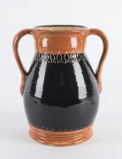 Australian pottery vase with sgraffito gumleaf decoration, signed "R" on the base, 19cm high