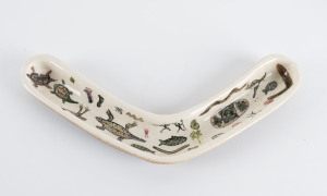 Australian pottery boomerang dish with Aboriginal motif, incised "Tom Kelpes, 1956 Eileen", 30cm across