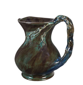 MERRIC BOYD, CRUFFEL Porcelain windswept tree jug glazed in blue, green and brown, ​19cm high