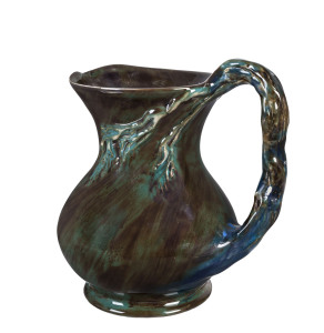MERRIC BOYD, CRUFFEL Porcelain windswept tree jug glazed in blue, green and brown, 19cm high