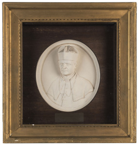 JAMES LAURENCE WATTS [1849 - 1925], A medallion portrait cast in plaster of Paris of Robert Dunne, Catholic Archbishop of Brisbane, the cast signed lower right "J.L.Watts" Mounted in the original timber case (under glass), frame dimensions 37.5 x 35cm wit