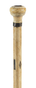 A whalebone walking stick with whale's tooth handle, silver collar and inlay, 19th century, 88cm high