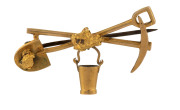 A gold miner's brooch, crossed pick and shovel with swinging bucket and gold nuggets, 19th century, stamped 9ct with pictorial maker's mark in the form of a key, 4cm across, 4.6 grams