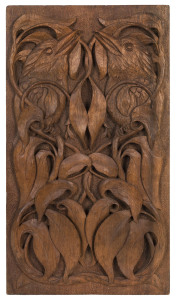 An Australian Queensland maple plaque carved with laughing kookaburras surrounded by gum leaves, early 20th century, 46 x 26cm