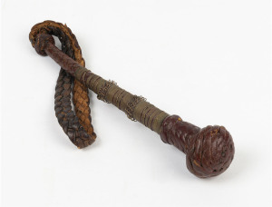 A leather cosh with brass wire binding and weighted end, 19th century, 38cm long