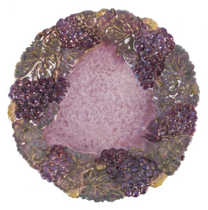 UNA DEERBON pottery fruit platter with applied grape motif, signature obscured by glaze but partially legible, 28cm diameter
