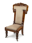 An early Colonial Tasmanian prayer chair with finely carved scrolling back and centurion skirt legs, birdseye huon pine with later velvet upholstery, circa 1835, ​96cm high