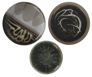 Three assorted pottery platters and bowls, 20th century, the largest 37cm diameter