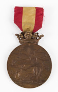 Bronze medal from the Exposicion Universal De Barcelona, 1888; together with a San Francisco World Fair 1915 colour lithograph aerial view showing the listed exhibitors, framed and glazed 50 x 100cm overall