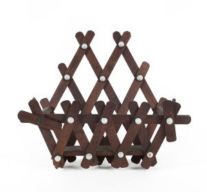 An Australian cedar letter rack studded with porcelain rivets, circa 1890, 28cm high