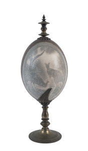 A carved emu egg with kangaroo and emu on turned metal stand, late 19th century, 24cm high