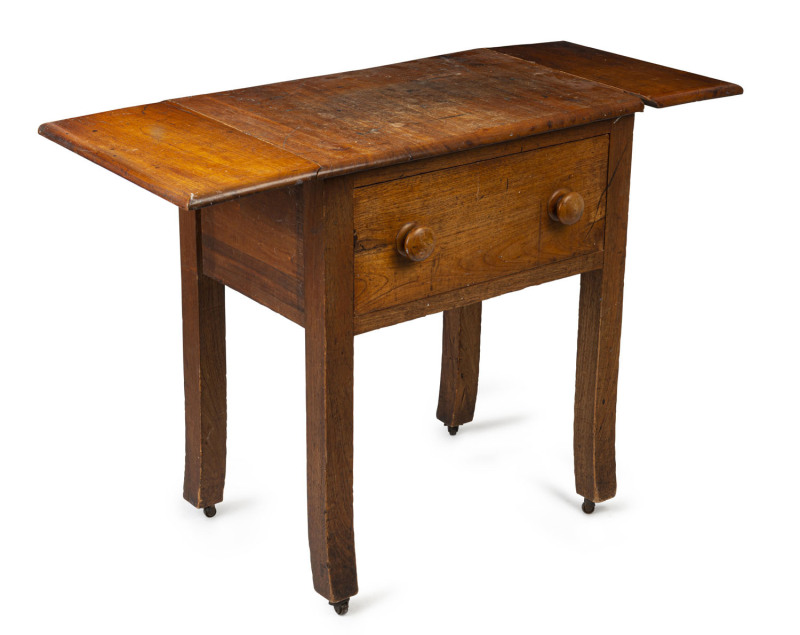 An Australian cedar book press drop-side table, 19th century, 77cm high, 67cm wide ( extends to 107cm), 49cm deep