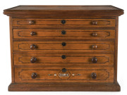An unusual miniature chest of drawers, cedar and pine with inlaid escutcheons and monogram, lift top with tray compartments, 19th century, ​55cm high, 73cm wide, 35cm deep
