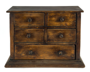 A miniature chest of five drawers, stained pine, early 20th century, 27cm high, 36cm wide, 19cm deep