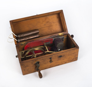 An electric shock machine in mahogany case, 19th century, 26cm across