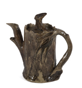 WILLIAM RICKETTS pottery teapot of tree stump form with applied gum leaves and nuts with branch handle, inscribed "Wm. Ricketts, Potters Sanctuary Mt. Dandenong, 1936", 17cm high