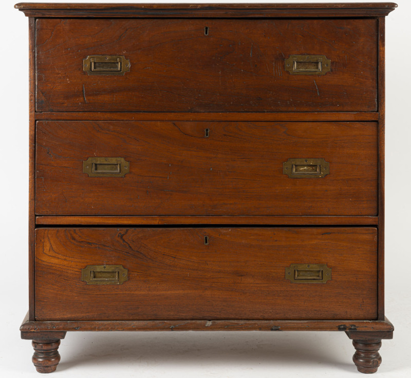 An unusual Australian cedar three drawer chest with inset campaign handles and finely turned legs, early to mid 19th century, 90cm high, 92cm wide, 48cm deep