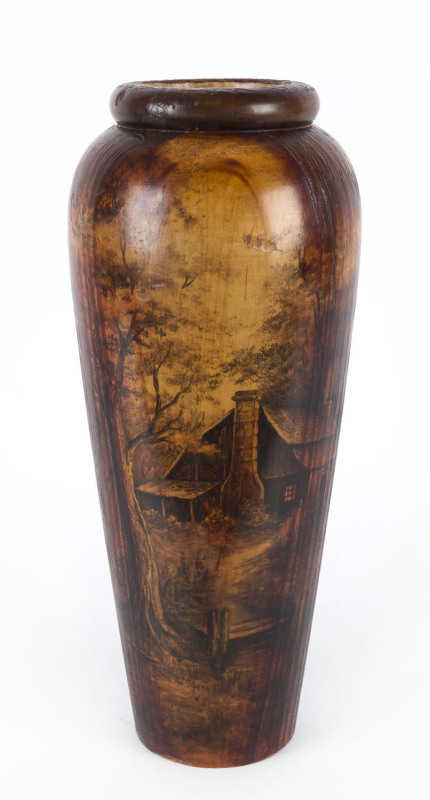 A Tasmanian huon pine vase painted with a cottage scene in landscape, circa 1920, 45cm high