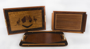 Three Australian timber trays, Queensland origin, 20th century, the largest 59cm across the handles