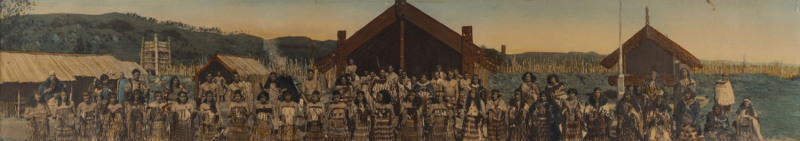 Robert Percy MOORE (New Zealand, 1881 - 1948) A panoramic photograph of a large Maori group at Whakarewarewa model village, Rotorua, New Zealand, circa 1925, hand-coloured silver gelatin photograph (18 x 95cm), in original glazed wooden frame.