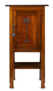 An Australian blackwood Arts and Crafts one door cabinet, early 20th century, 140cm high, 69cm wide, 43cm deep