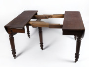 An Anglo-Indian campaign table, teak and oak, circa 1840, ​unfortunately missing leaves, 75cm high, 112cm wide (extends to 265cm wide with extra leg), 138cm deep - 2