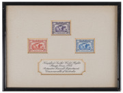 THE 2d, 3d & 6d KINGSFORD SMITH COMMEMORATIVE STAMPS OF MARCH 1931 The unique presentation set of three stamps as issued, in sunken card overmounted with cream card, with the ornately hand-lettered dedication: "Kingsford Smith's World Flights. Stamp Issue