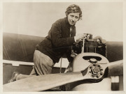 AMY JOHNSON'S FLIGHT FROM ENGLAND TO AUSTRALIA A Columbia 78rpm recording of Amy Johnson talking about her flight 'The Story of My Flight,' recorded in Sydney in 1930. and signed A. Johnson on the label; a press photo, with citation describing Johnson as