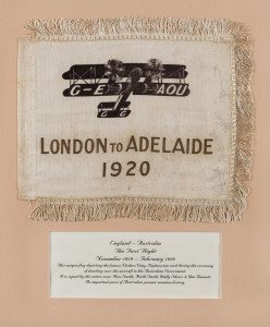 1919-20 London to Adelaide framed Air Race Flag (300x235mm) in brown and gold on beige, fringed on three sides, illustrated with Vickers Vimy 'G-EAOU' Biplane, signed by Ross Smith, Keith Smith, J.M.Bennett, & W.H.Shiers, together with a photo-postcard of