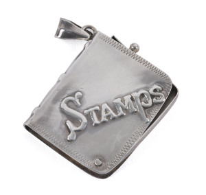 Stamp Boxes - Silver: Edwardian single-size case in the form of a book (27x33mm), sterling silver marked 'A925A', 'Stamps' impressed on face, swivel hinged on a retaining pin, weight 14g, small loop for attaching to a fob chain, excellent condition overa