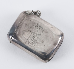 Vesta Case - Silver: 1907 plain small case (32x44mm), engraved "WAJ" on front, weight 26gr, hallmarked in Birmingham, HINGED STAMP COMPARTMENT, somewhat compressed and tarnished, with split at top & puncture at base, small ring for fob chain attachment.