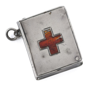 Stamp Boxes - Silver: 1910(?) Crisford & Norris single-size case in the form of a book, engraved cross on the face highlighted in red enamel, swivel hinged on a retaining pin, weight 10g, fair condition with some denting, small loop for attaching to a fob chain. Unusual.