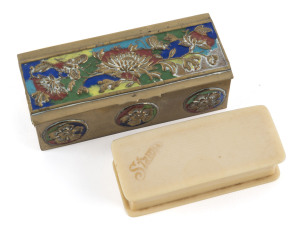 Stamp Boxes: 20th century brass Chinese made stamp box (100x46x31mm) with three sloped compartments, coloured enamel floral design, weight 149gr; also plain bakelite stamp box (81x33x20mm) also with three sloped compartments marked 'Stamps" on the lid in 