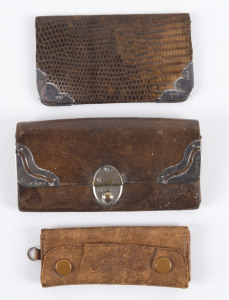 Stamp/Coin Wallets: comprising 1888 H.W.Bedford Regent St (London) snakeskin stamp/card wallet with silver corners, in good condition; Birmingham made leather purse, two silver corners and a silver clasp, four internal compartments, minor faults; Russian leather "sovereign" purse with 9 individual coin pouches within, tear at front. Nice group. (3 items)