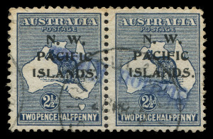 NEW GUINEA - 'N.W./PACIFIC/ISLANDS' Overprints: 1915-16 (SG.74) First Wmk 2½d indigo pair (short perfs, edge tone), with complete strike of straight-line 'Station Kieta' handstamp in blue, Powell Type. 65, Rated F, overstruck with a weak strike of indistinct datestamp. Complete strikes of the handstamp are rare.