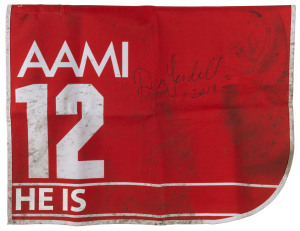 AAMI VICTORIA DERBY 2019 Horse No.12 (Barrier 14), HE IS, Jockey: Dean Yendall, The unique number 12 saddlecloth, signed by Dean Yendall, accompanied by a letter of authenticity and limitation signed by Neil Wilson, CEO, Victoria Racing Club, Limited and the official AAMI Victoria Derby Day Racebook.
