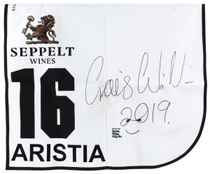 SEPPELT MACKINNON STAKES 2019 Horse No.16 (Barrier 5), ARISTIA, Jockey: Craig Williams, The unique number 16 saddlecloth, signed by Craig Williams accompanied by a letter of authenticity and limitation signed by Neil Wilson, CEO, Victoria Racing Club, Limited and the official Seppelt Wines Stakes Day Racebook.