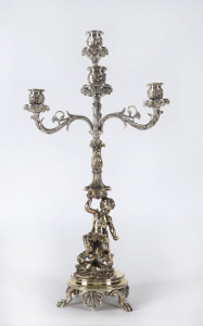 A silver plated four branch candelabra with cherub and dolphin base, 19th century, ​48cm high