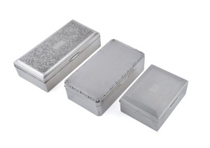 Three sterling silver cigarette boxes, early to mid 20th century, ​the largest 18cm across